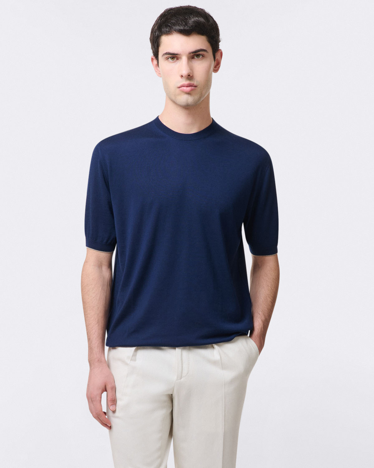 Pure virgin wool crew neck sweater with ribbed trim. Short sleeves