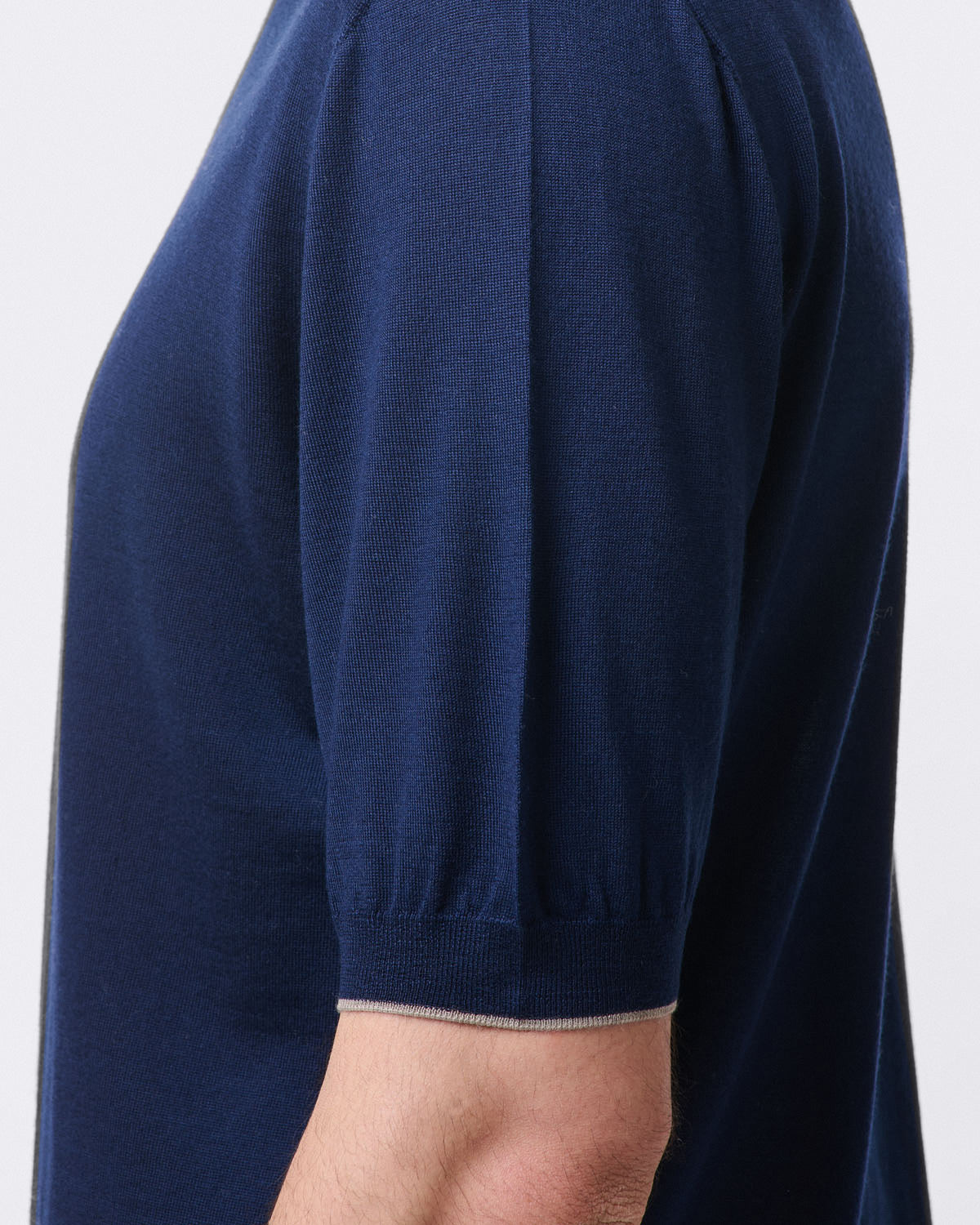 Pure virgin wool crew neck sweater with ribbed trim. Short sleeves