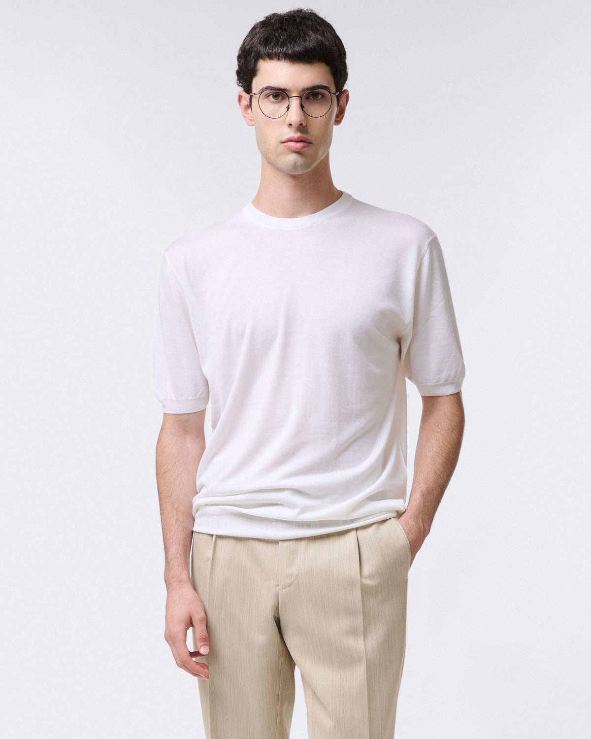 Pure virgin wool crew neck sweater with ribbed trim. Short sleeves