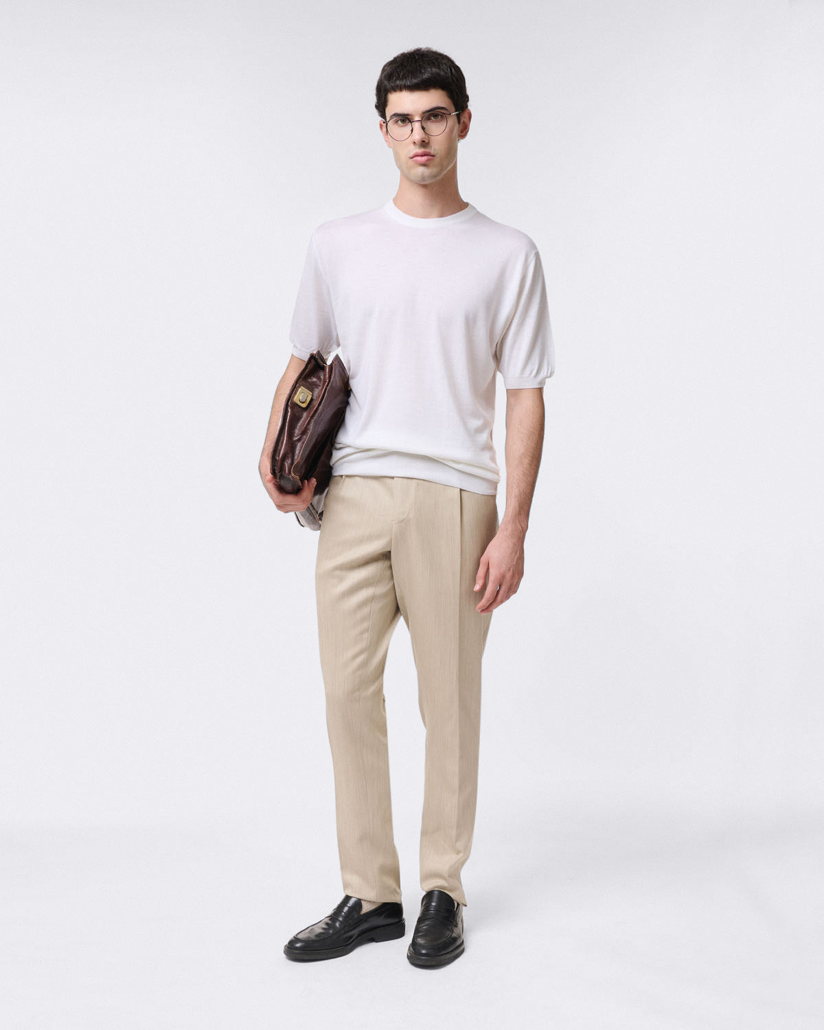 Pure virgin wool crew neck sweater with ribbed trim. Short sleeves