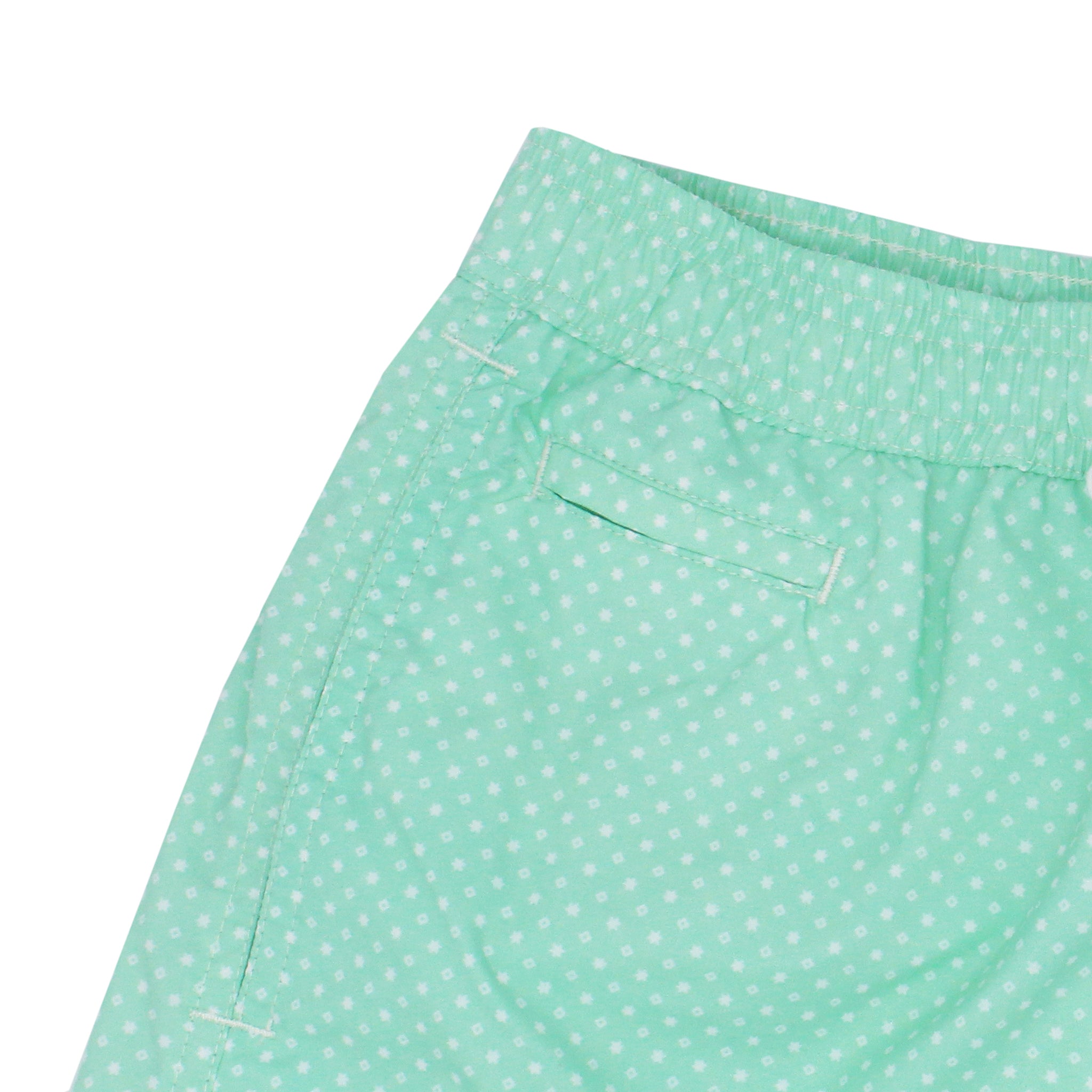 Costume da bagno verde chiaro con pois. Asciugatura rapida e multitasche