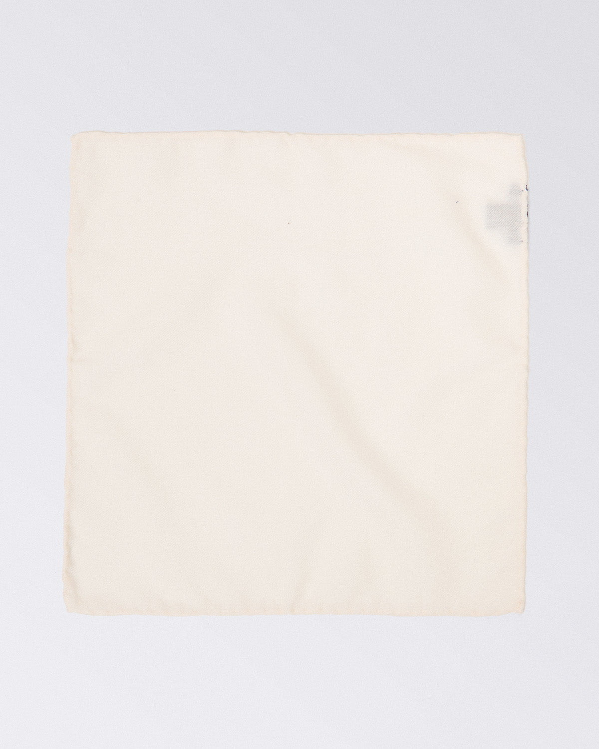 Hand finished single colour wool pocket square. White