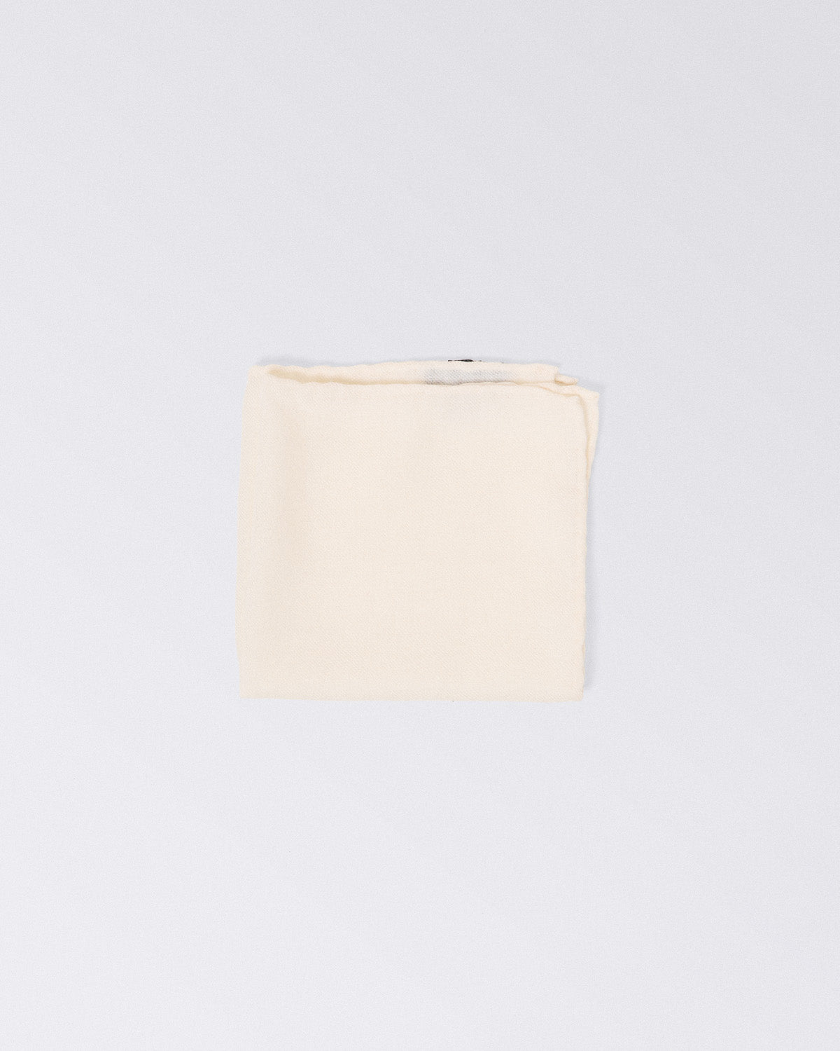 Hand finished single colour wool pocket square. White