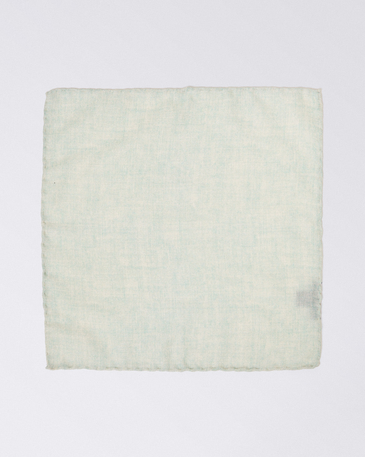 Hand finished single colour wool pocket square. Light green
