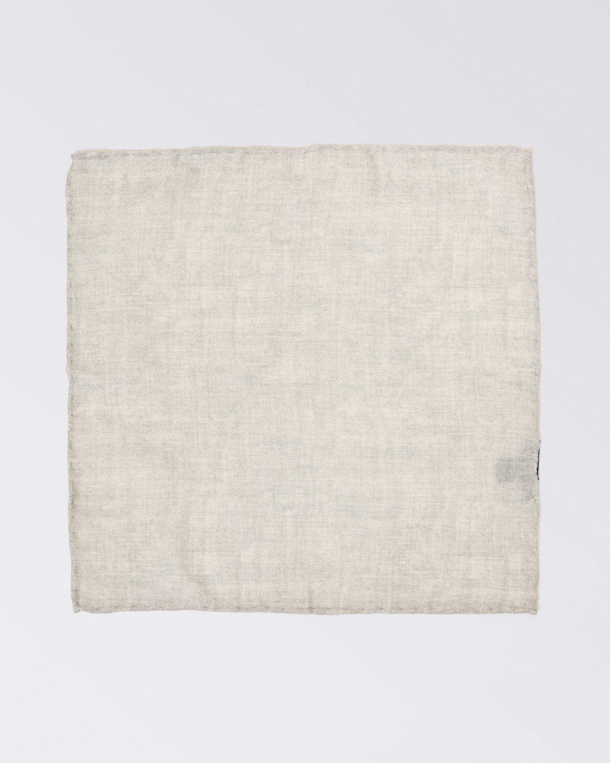 Hand finished single colour wool pocket square. Light Gray