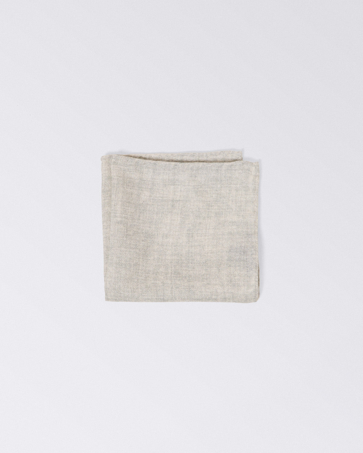 Hand finished single colour wool pocket square. Light Gray
