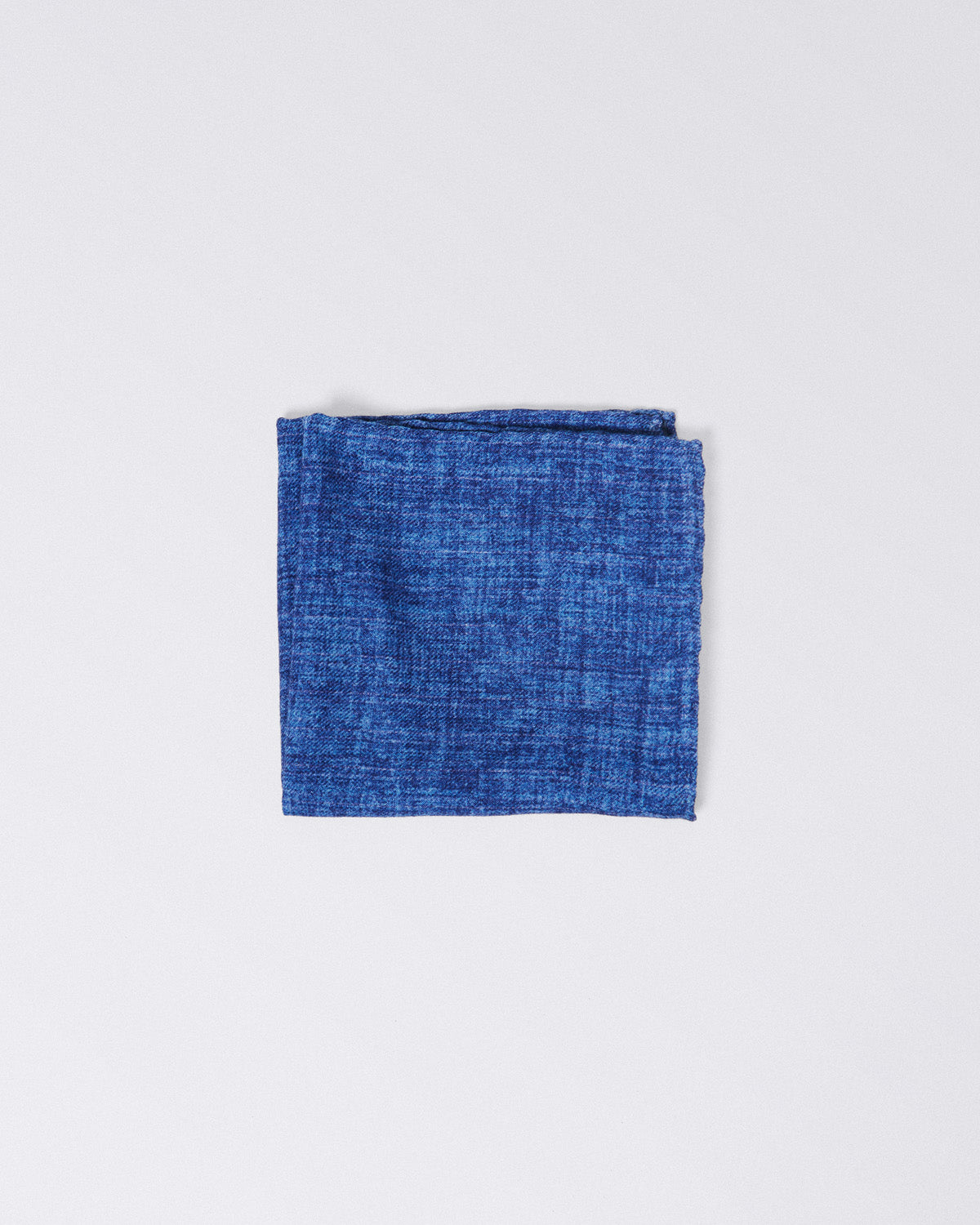 Hand finished single colour wool pocket square. Blue