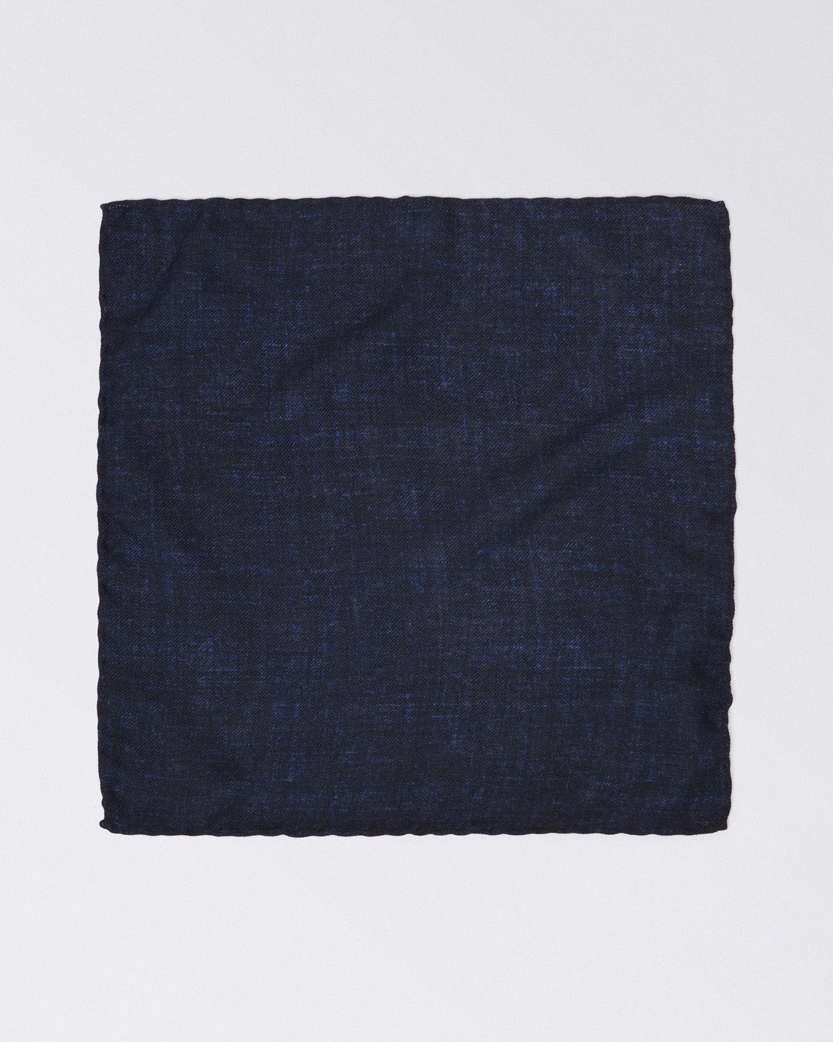 Hand finished single colour wool pocket square.