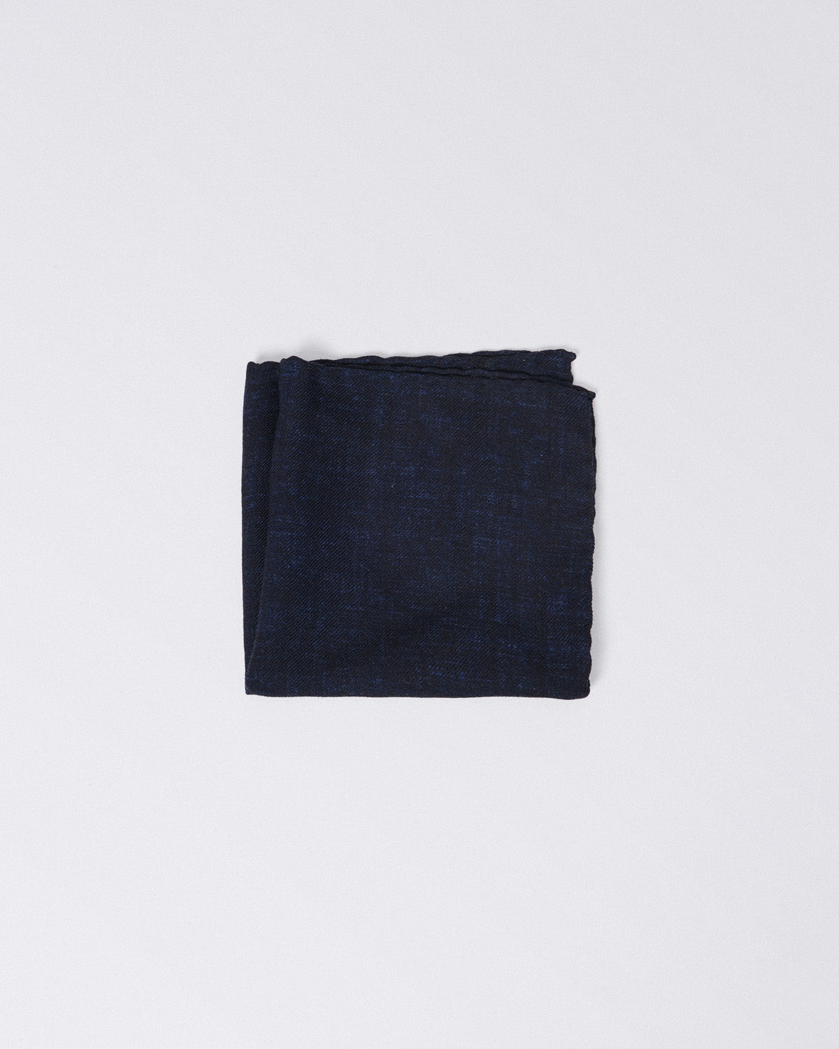 Hand finished single colour wool pocket square.