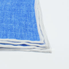 Linen pocket square with light blue background and white border