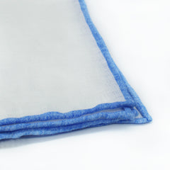 Linen pocket square with white background and light blue border